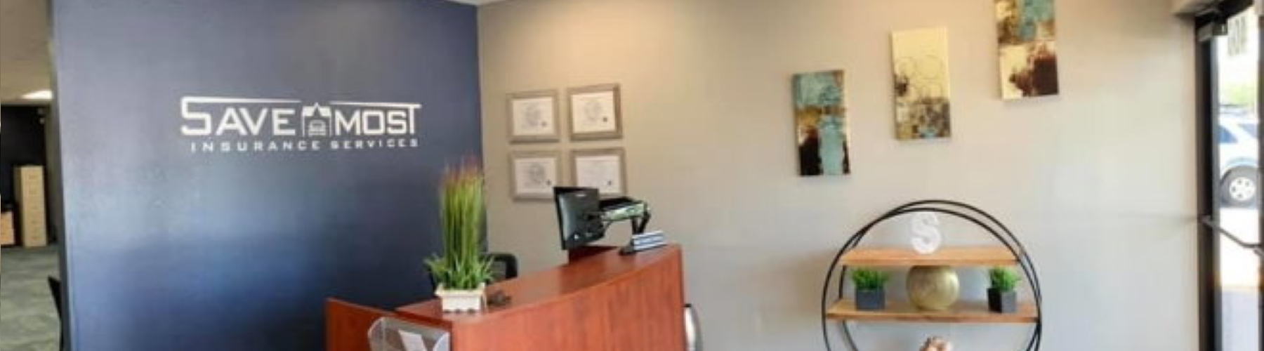 front office wall and desk at Save Most Insurance
